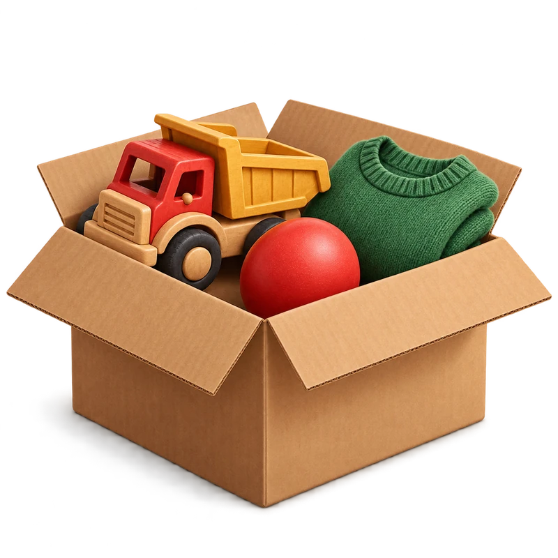 A cardboard box holding a wooden toy lorry, a red ball and a folded green jumper.